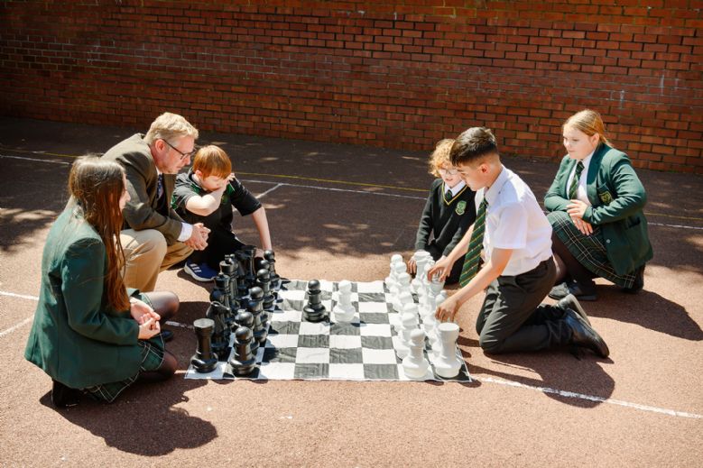 Young children playing chess