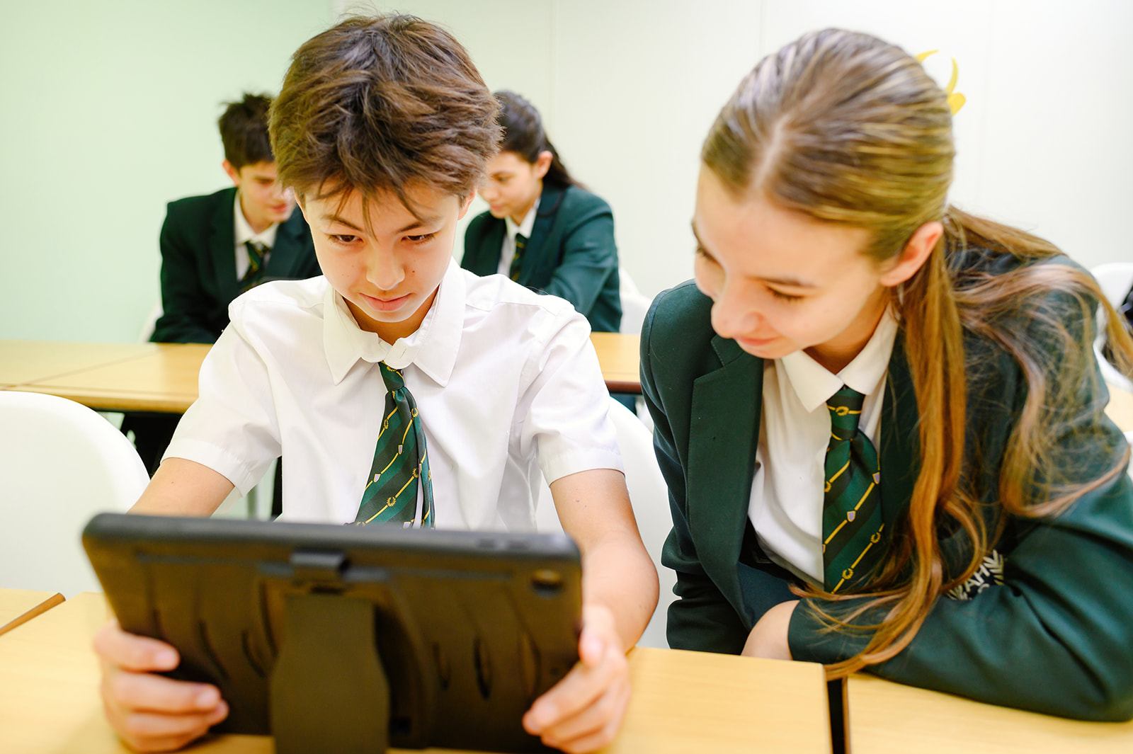 Senior pupils working on an IPad