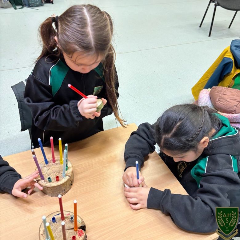 Pupils creating their name badges 