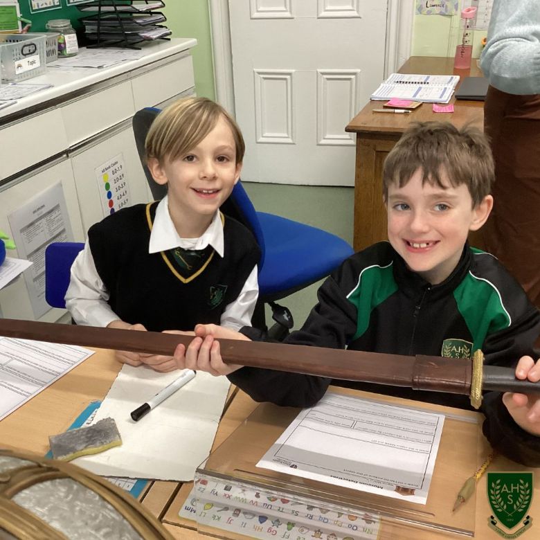 Pupils exploring artifacts 